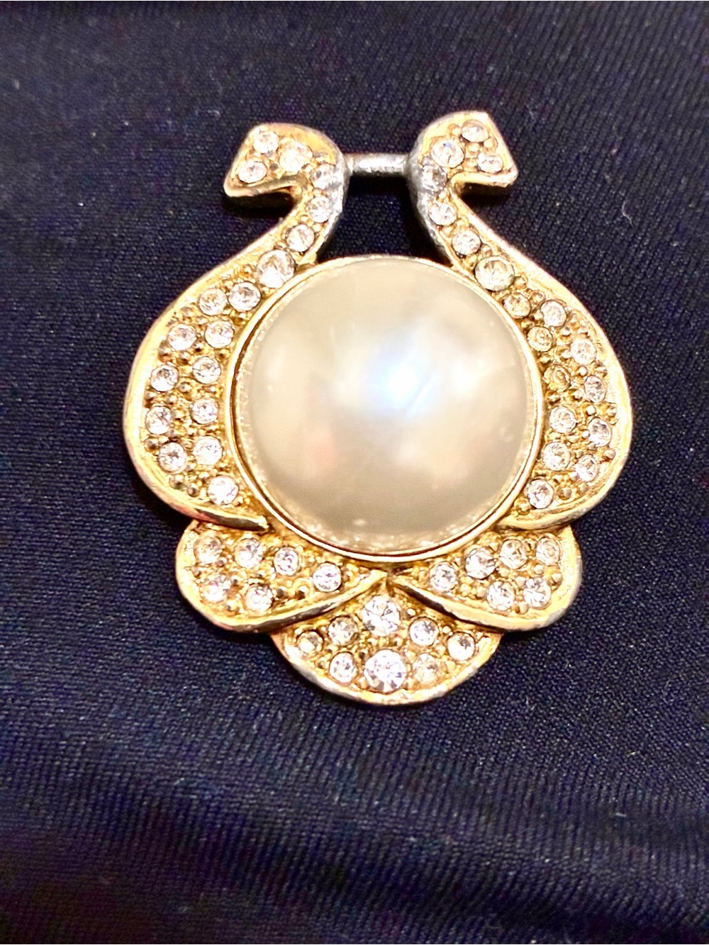 VINTAGE, Nolan Miller, Gold-Tone Faux Pearl Center pendant surrounded Crystals -